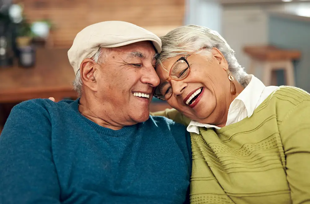 Senior woman cuddling with her dog